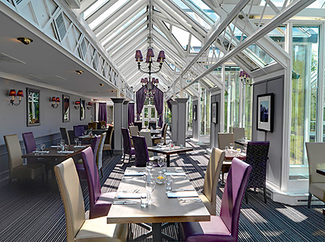 The Maze Restaurant is located in a glass house overlooking the six-acre gardens, which feature a maze and fountain.