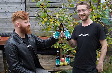 • Chris Moriarty and Jake Griffin of Drygate with the craft brewer’s Outaspace Apple Ale.