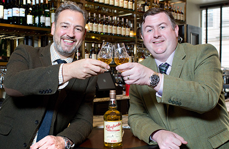 • Hutchesons owner James Rusk (left) and George Grant of Glenfarclas toast new partnership.
