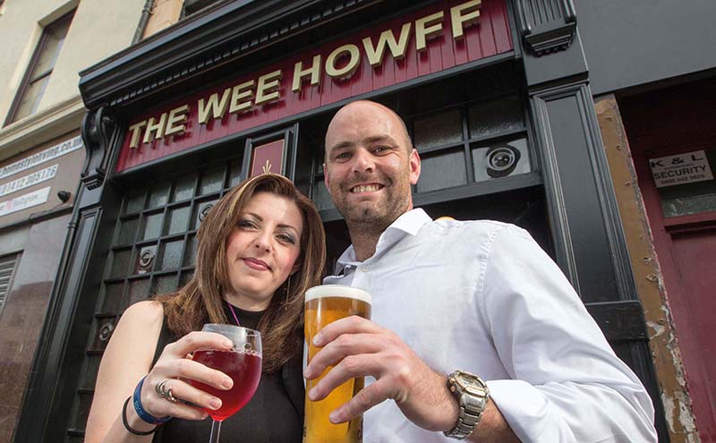 Lisa and George raise a glass to their new careers at the helm of the pub.