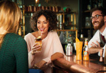 woman-drinking-cocktail-in-bar