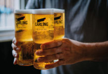 Keep calm and Carling on Man-carrying-four-pints-of-carling