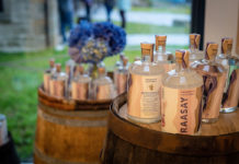 Bottles of Rassay Gin on barrels