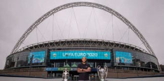 Thiery Henry with UEFA trophies