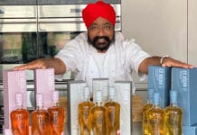 Tony Singh pic with Cù Bòcan whisky bottles