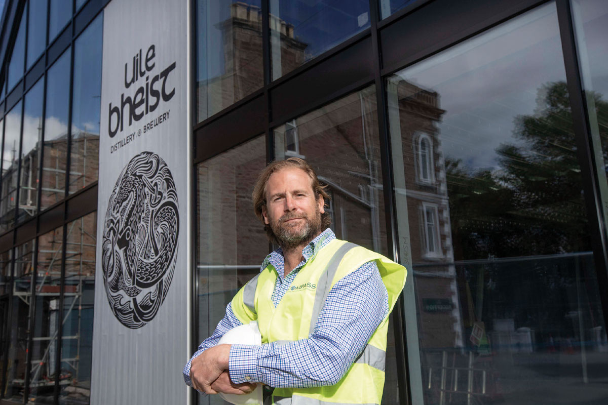 Uilebheist owner Jon Erasmus stands infront of the new distillery