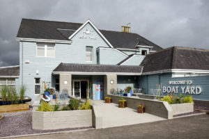 exterior of the Boat Yard restaurant with blue wooden cladding
