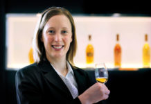 Gillian Macdonald of Glenmorangie holds a dram of whisky