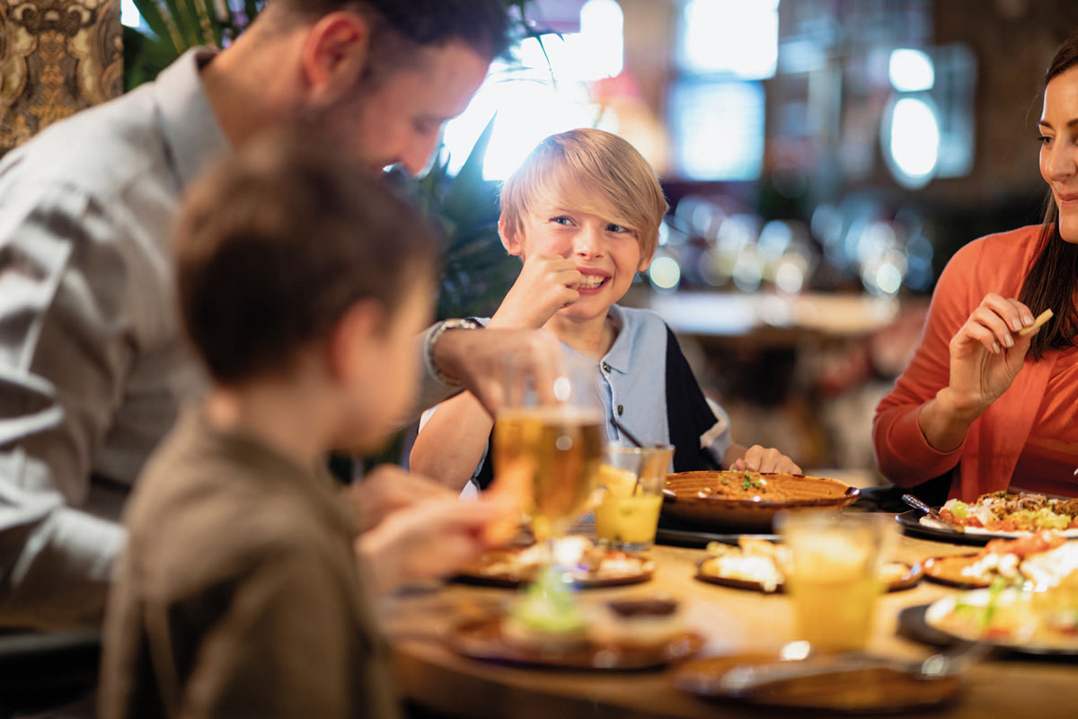 A family with young children eat in a pub restuarant