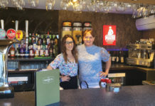 Lisini, Angels Hotel's Siobhan and Kay standing behind bar