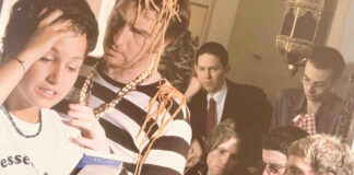 A waitress has a catastrophe whilst serving spaghetti to a group of customers