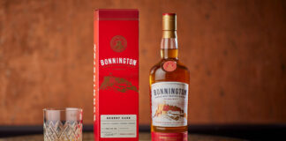 red whisky carton of bonnington whisky and a glass with a dram