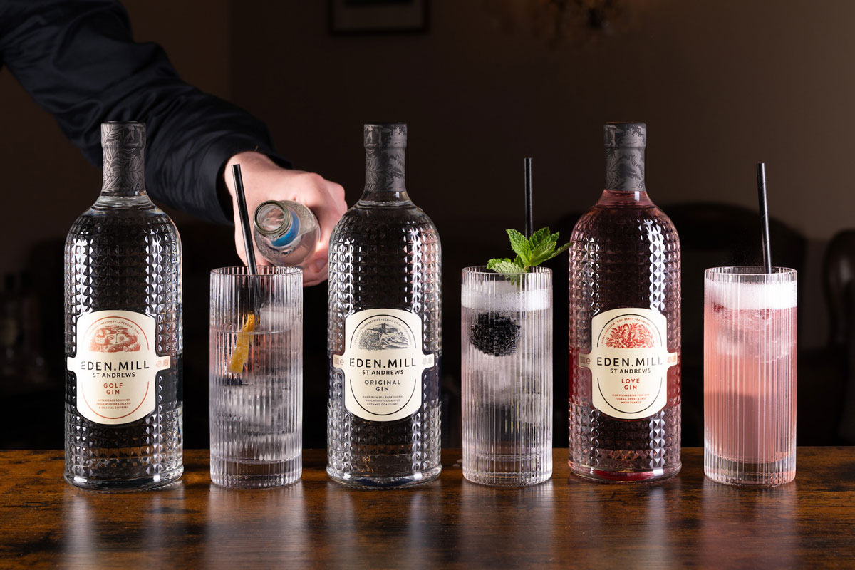 three bottles of eden mill gin with and tall glasses with gin serves