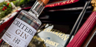 a bottle of criterion gin in front of the criterion bar