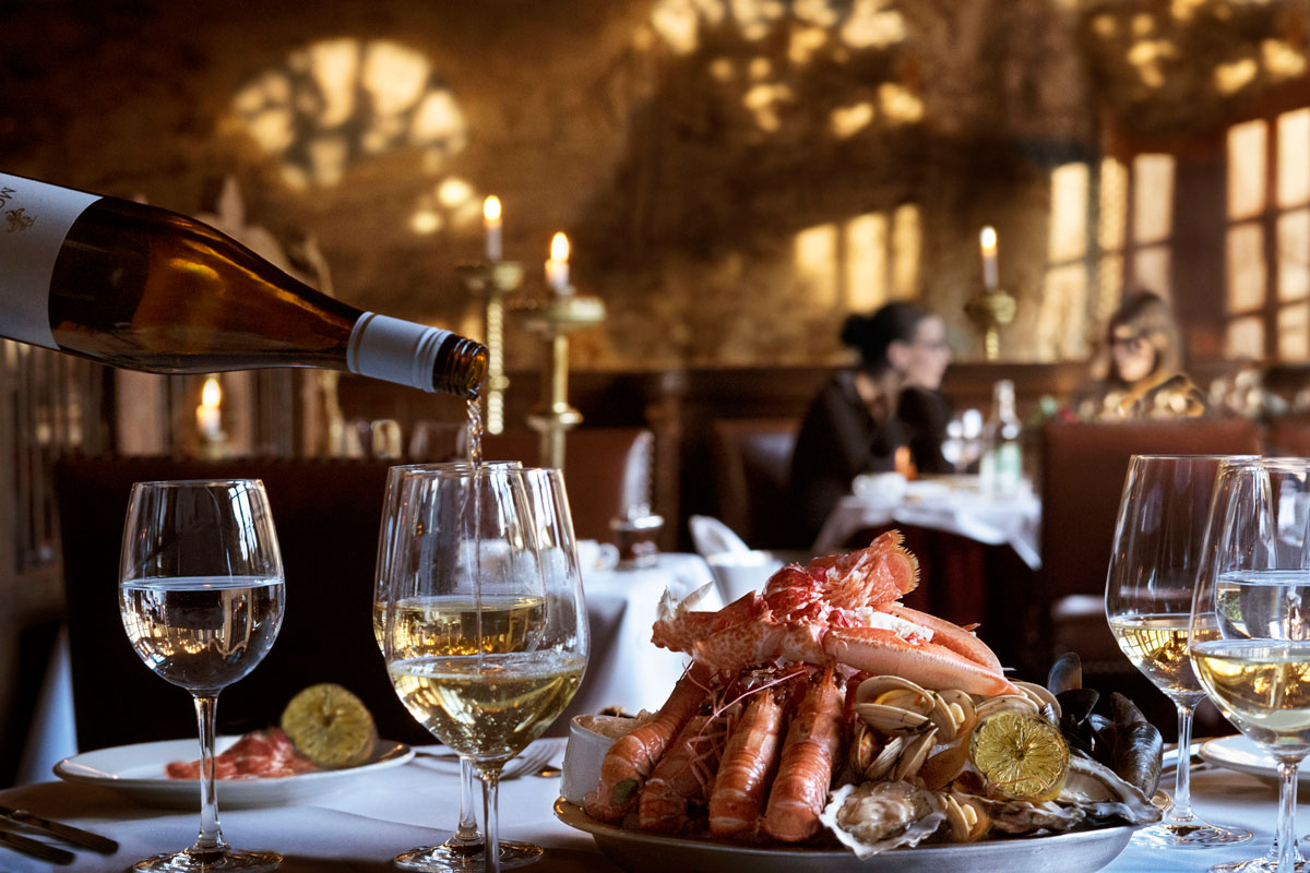 a seafood platter is served with white wine at prestonfield house