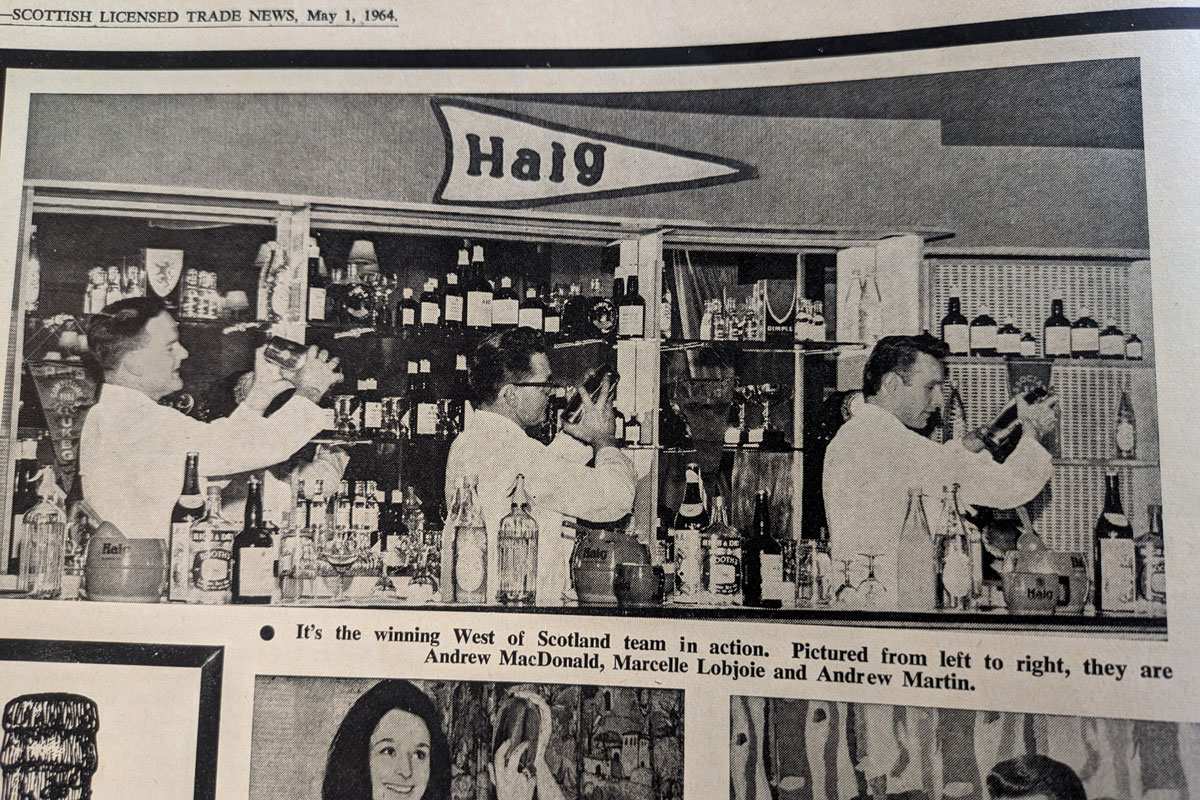 A newspaper clipping of old-fashioned bartenders shaking cocktails