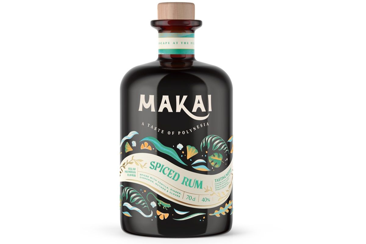 black bottle with Makai spiced rum label on the front against a white background