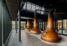 Whisky stills in a glass room