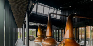 Whisky stills in a glass room