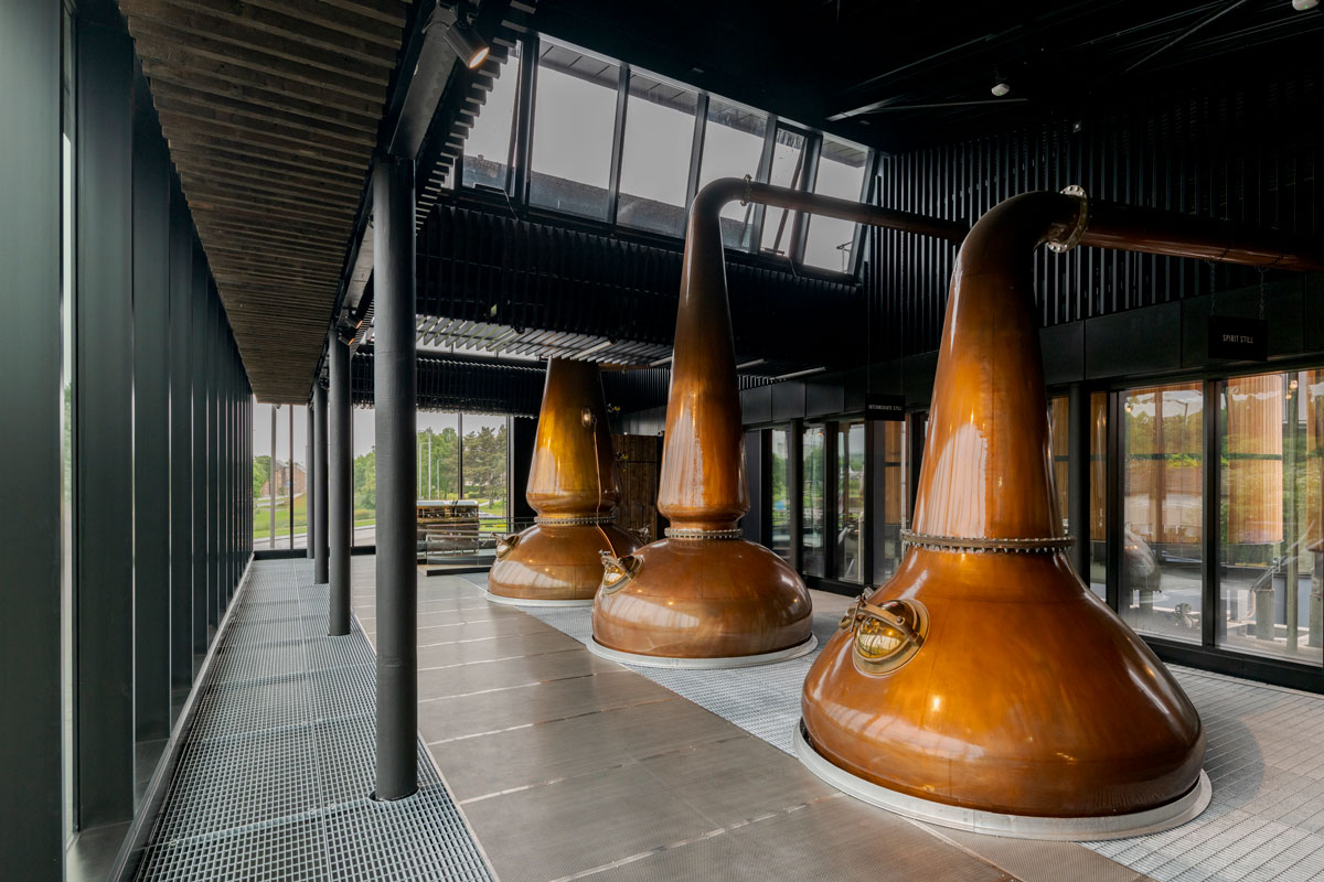 Whisky stills in a glass room