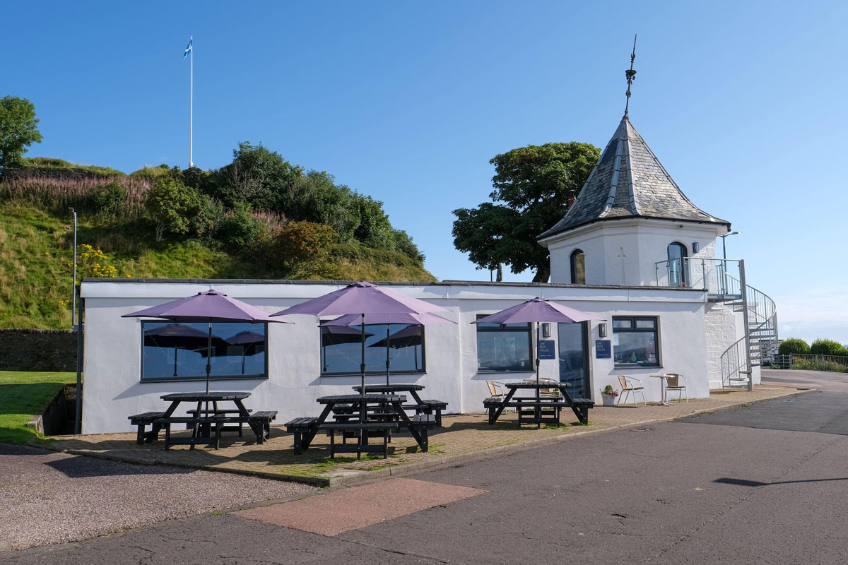 A seaside cafe with a pink roof