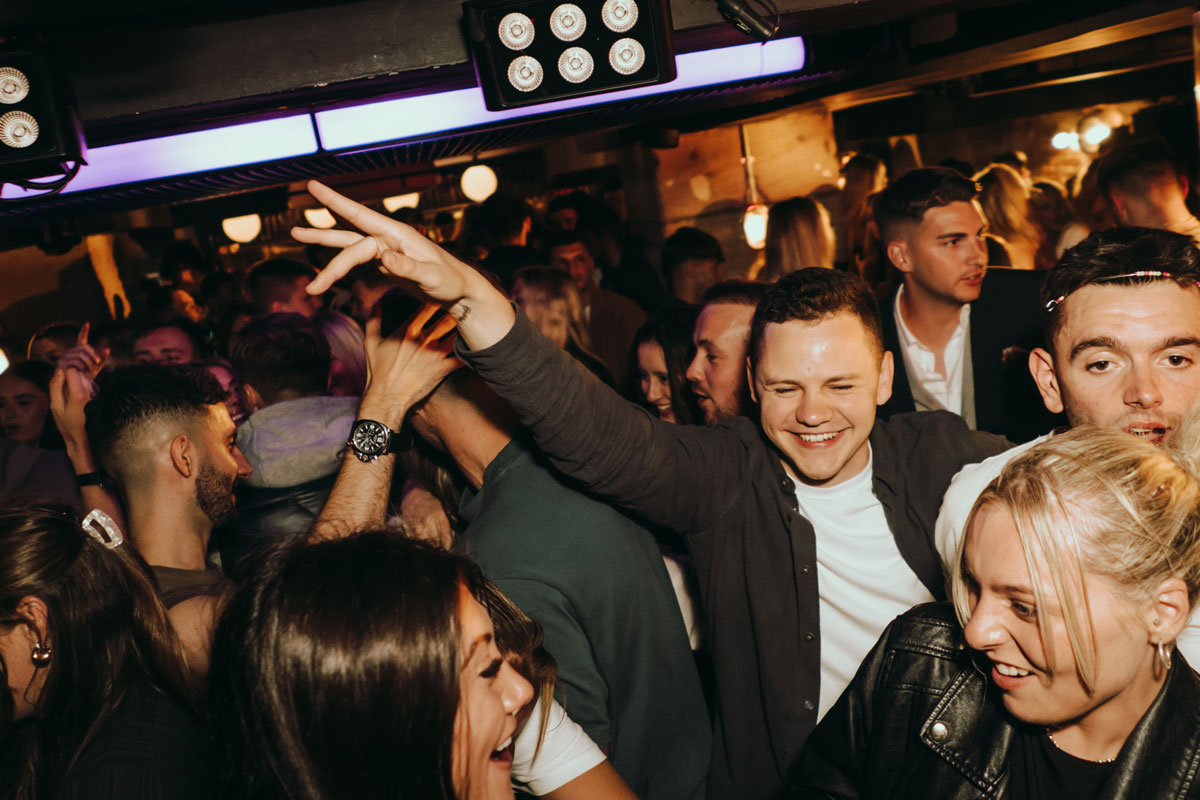 A crowd of young people enjoying a nightclub