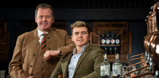 A smartly dressed father and son in a bar