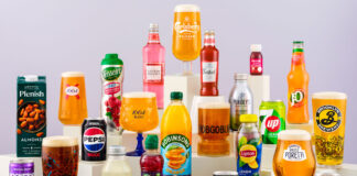 a colourful collection of bottles and cans containing both soft drinks and beer