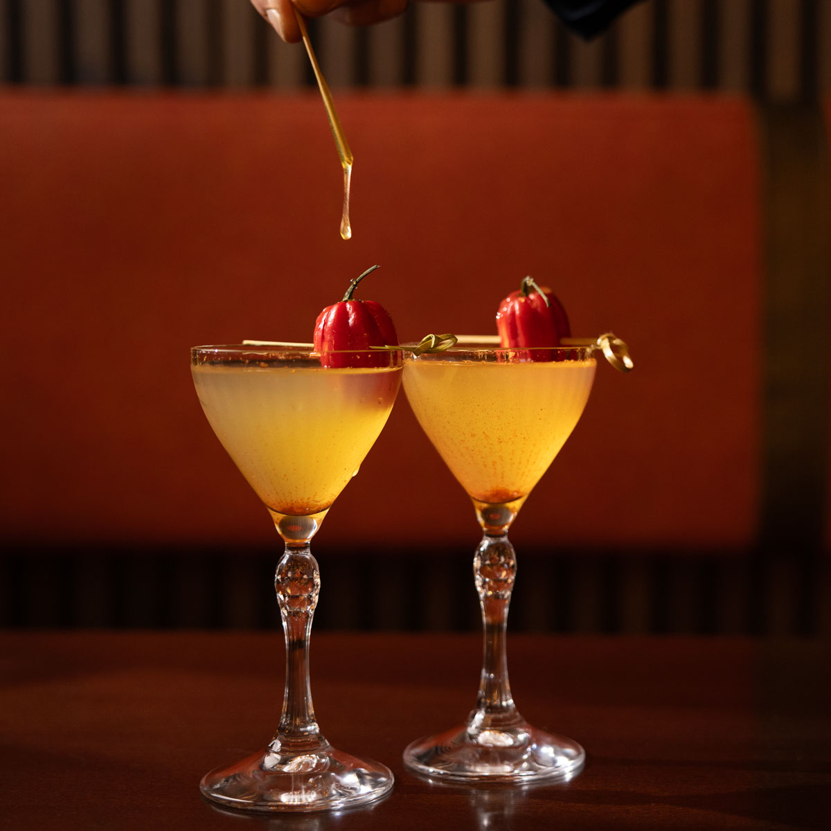 two peppery looking martini-style cocktails