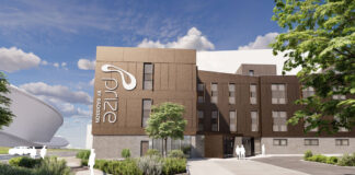 A CGI rendering of a small modern hotel