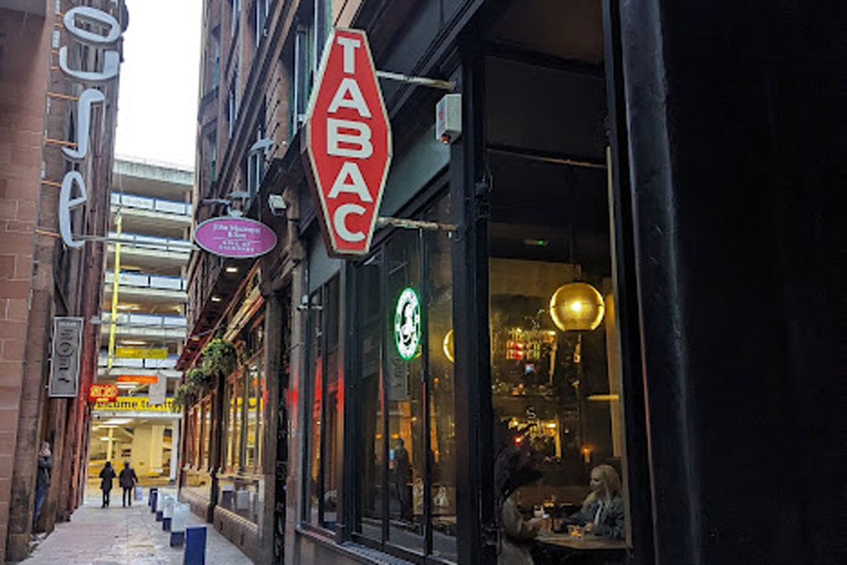 a bar sign up a Glasgow lane
