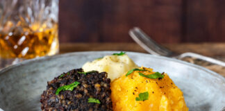 A plate with haggis, keeps and tatties.