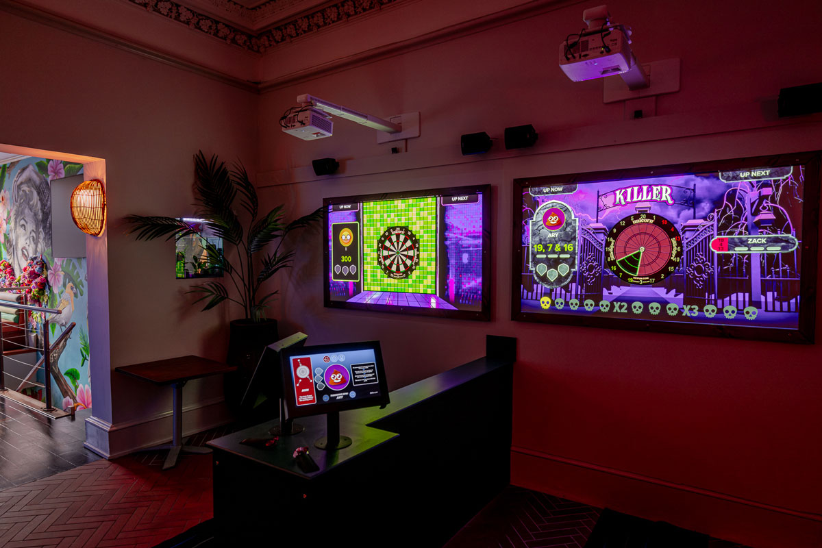 Two video screens with embedded darts boards