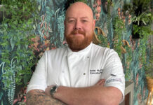 Chef Ewan McAllister appointed by SimpsInns to ‘elevate’ its food and drink a smiling bearded man in chef's whites