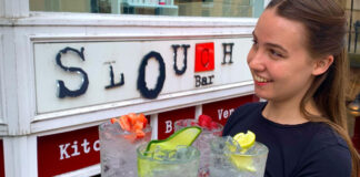 A young woman serves drinks