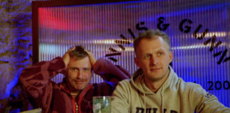 A comedian feigns exasperation next to a man who has just eaten quite a lot