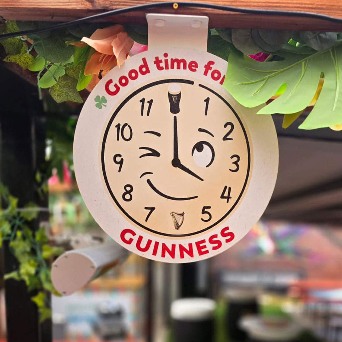 A clock face branded with Guinness