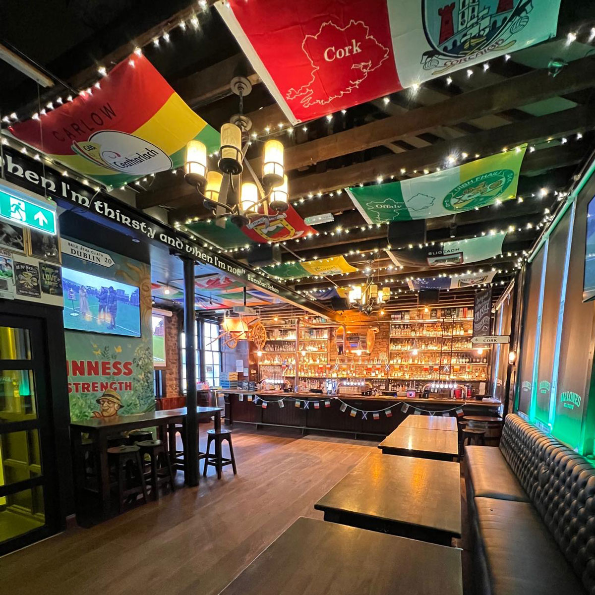 A sports bar adorned with international flags
