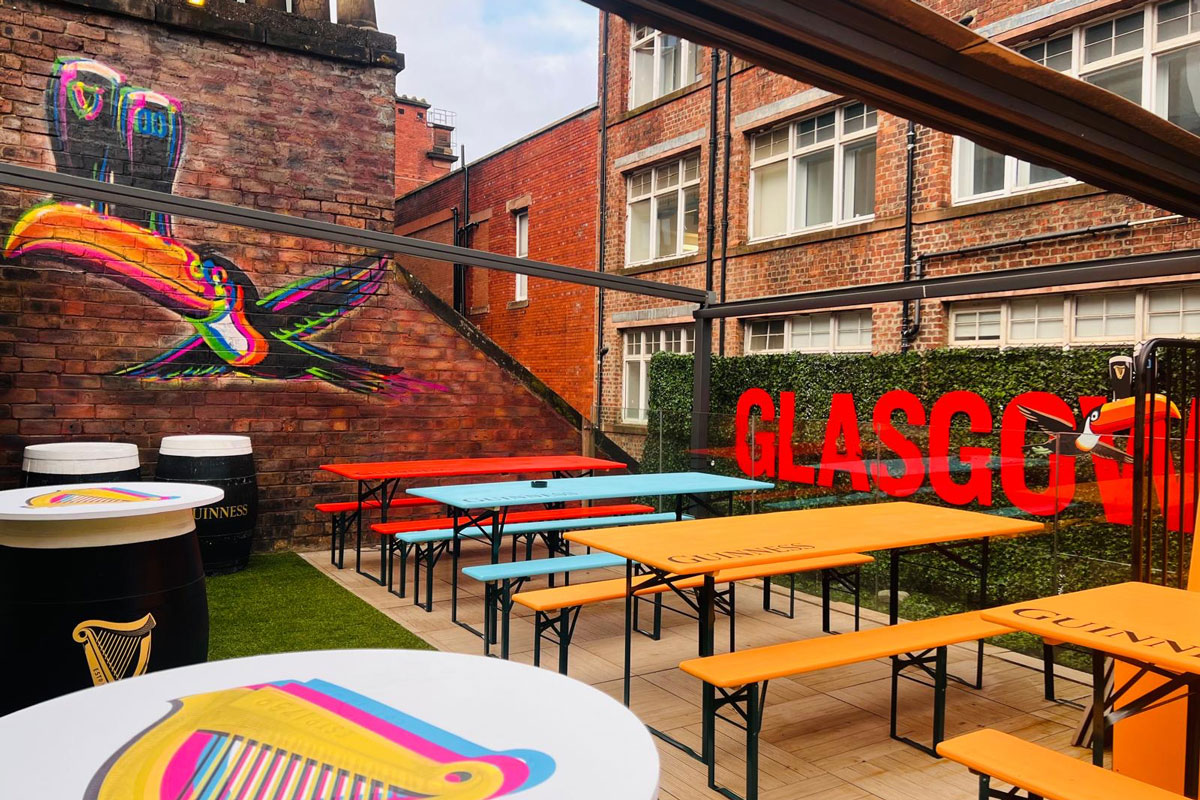 A rooftop bar adorned with Guinnes paraphernalia