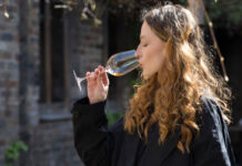 ‘Drinks List of the Year’ award for Timberyard and Montrose restaurants A young woman sips from a glass outdoors