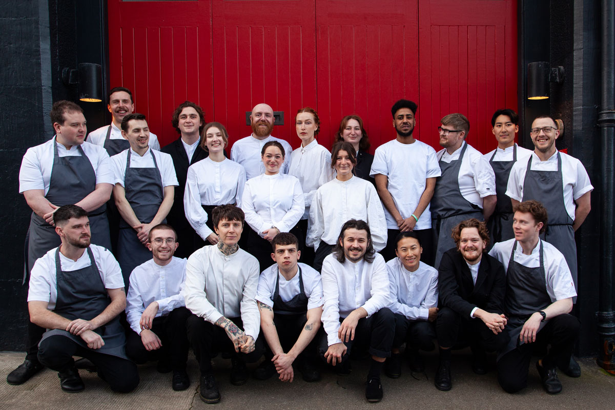 A smartly turned out restaurant staff team