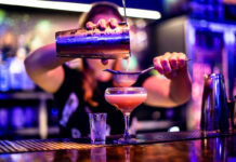 Neon nights in NQ64 can now start in daytime following license update A barperson pours a pink cocktail