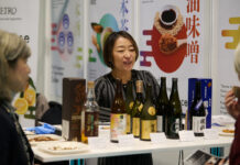 An exhibitor at ScotHot speaks to visitors.
