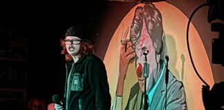 A young ginger comedian on stage