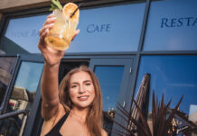 Cocktail Week comes to Dunfermline with 24 local businesses onboard A young woman holds up an iced drink in front of a hospitality venue
