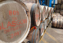 Whisky barrels stacked in a storage space
