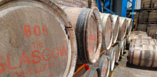 Whisky barrels stacked in a storage space