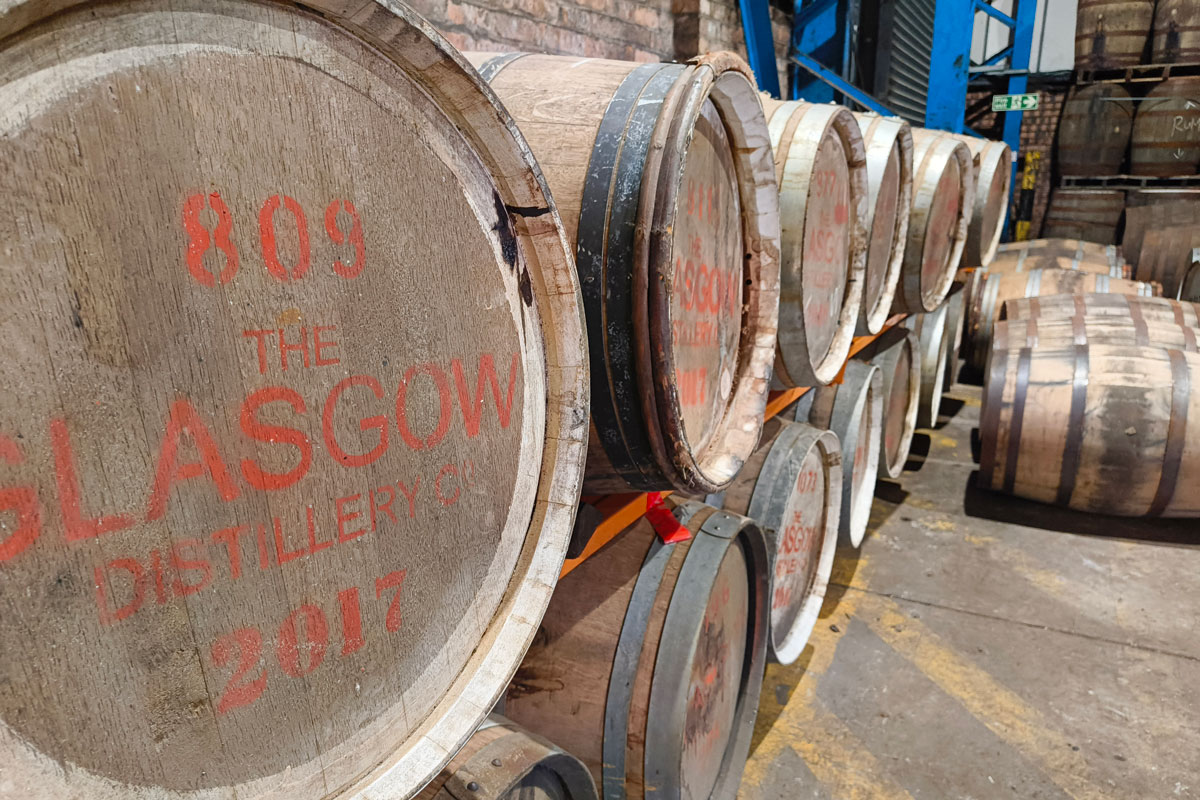 Whisky barrels stacked in a storage space