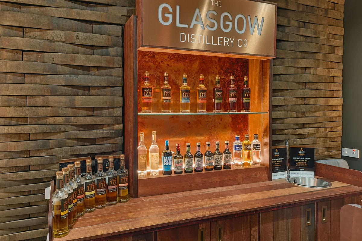 A selection of spirits bottles on a display cabinet