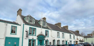 A traditional white-washed terraced village hotel